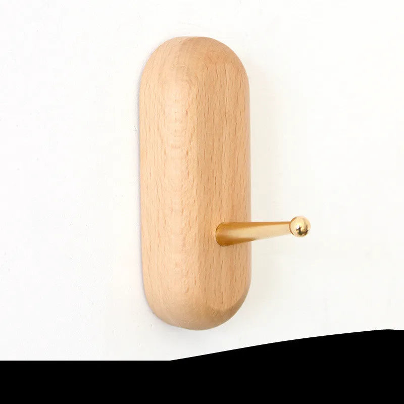 Beech wood adhesive wall hook with brass hook in five shape options including round, capsule, oval, diamond and square