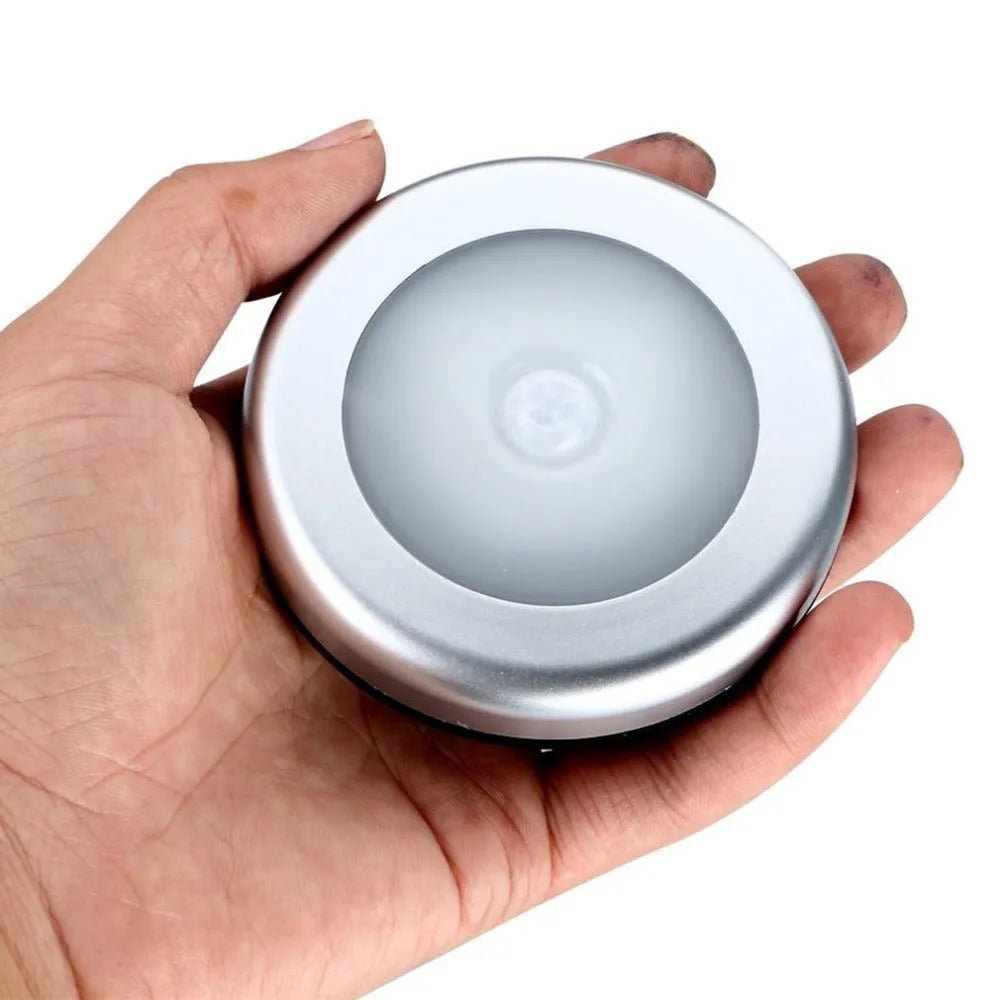 Silver wireless motion sensor night light with PC plastic lampshade measuring 80mm