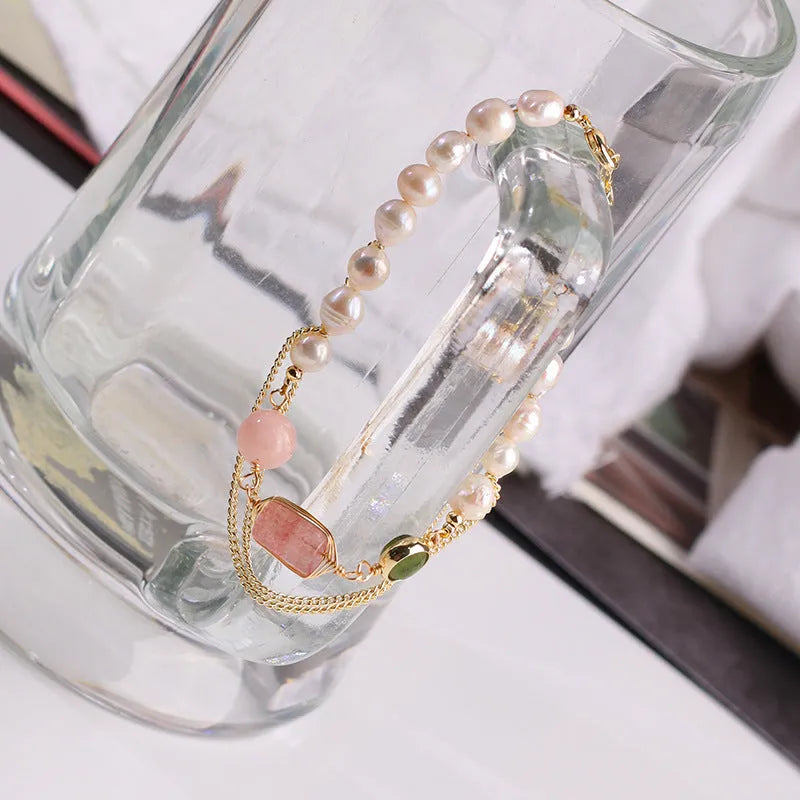 Women's pink freshwater pearl bracelet with geometric design and strawberry crystal charm