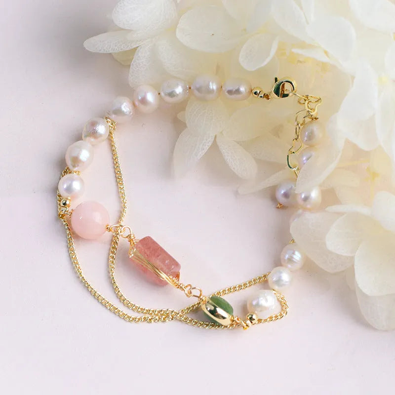 Women's pink freshwater pearl bracelet with geometric design and strawberry crystal charm