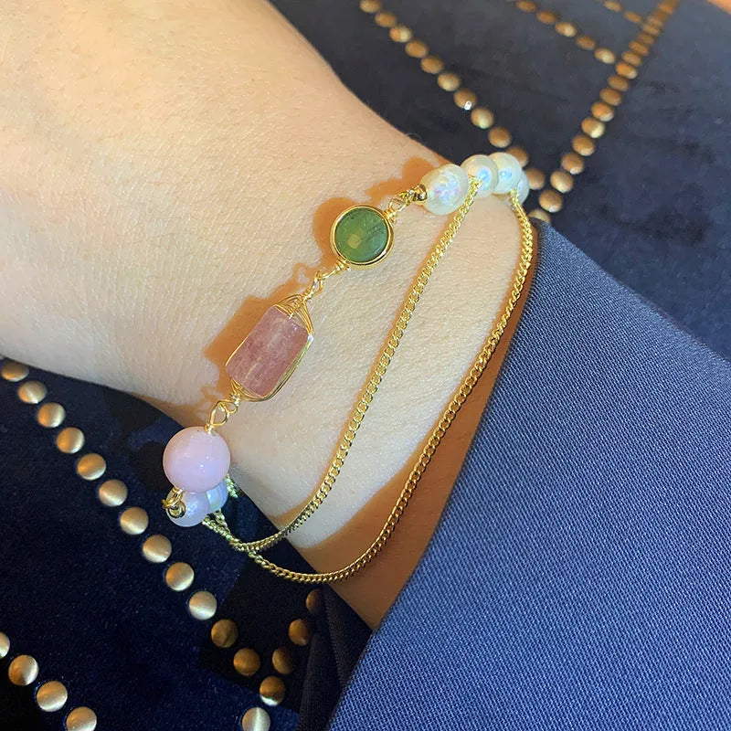 Women's pink freshwater pearl bracelet with geometric design and strawberry crystal charm