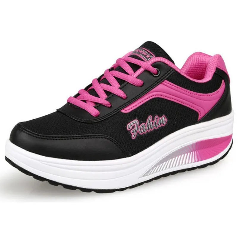 Women's grey powder mid-heel sports shoes for travel, shown from the side.