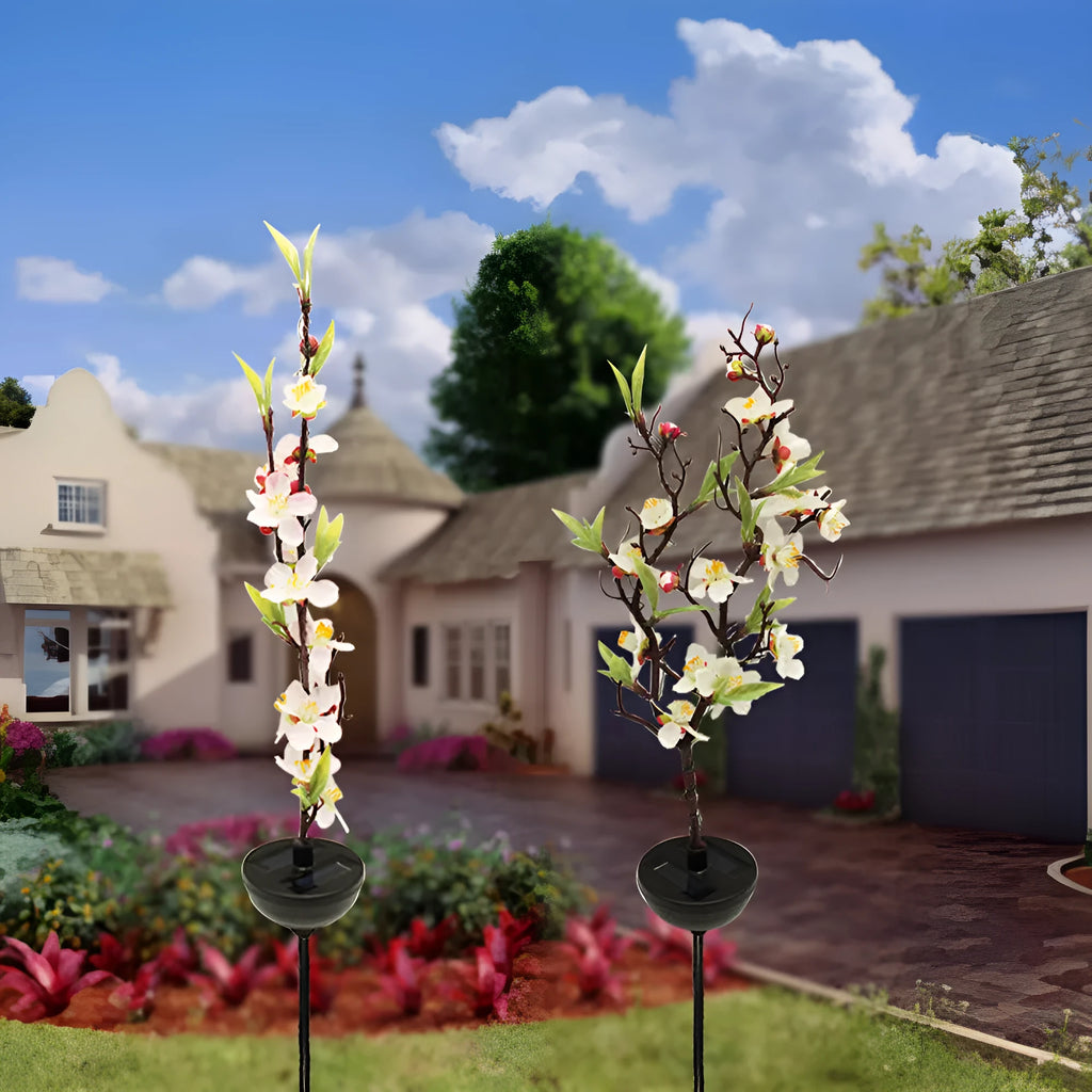 Solar-powered cherry blossom string lights with ground spike for outdoor garden decoration