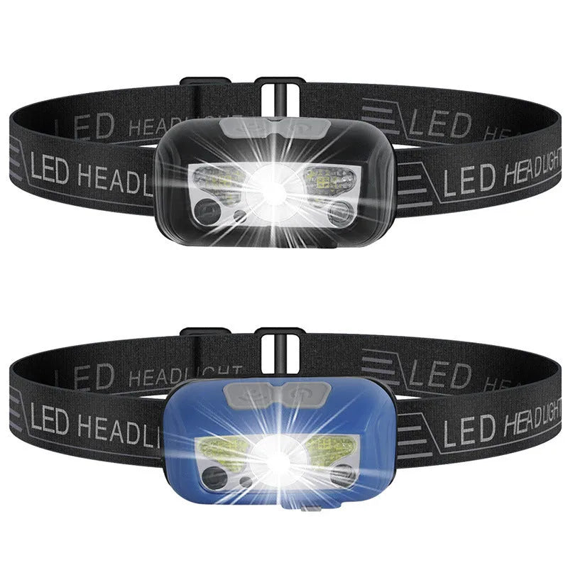 Black or blue LED sensor headlight with red running lights, shown with USB charging cable.