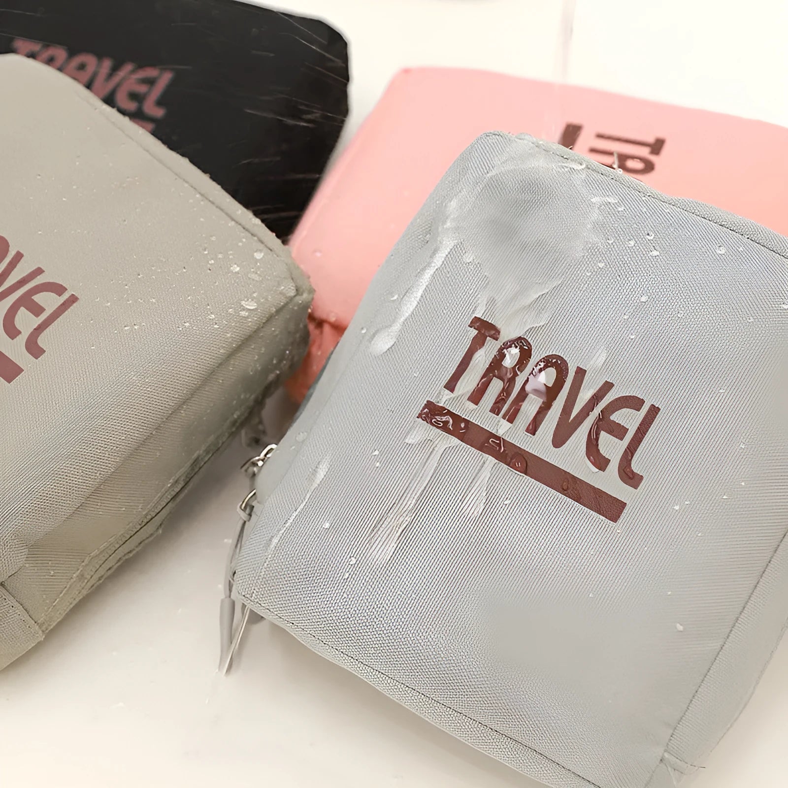 Cube-shaped travel storage bag in black, grey, khaki, or pink, made from 300D Oxford cloth.