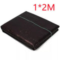 Black polyethylene weed-proof cloth laid on soil for farmland and garden weed suppression.