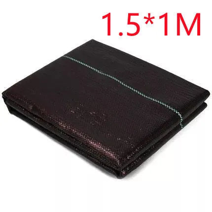 Black polyethylene weed-proof cloth laid on soil for farmland and garden weed suppression.