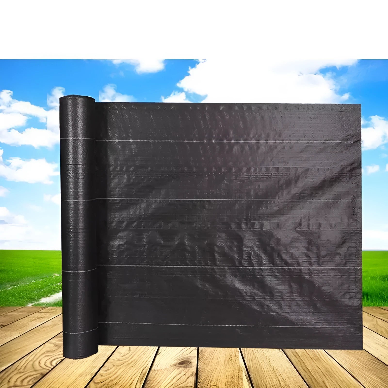 Black polyethylene weed-proof cloth laid on soil for farmland and garden weed suppression.
