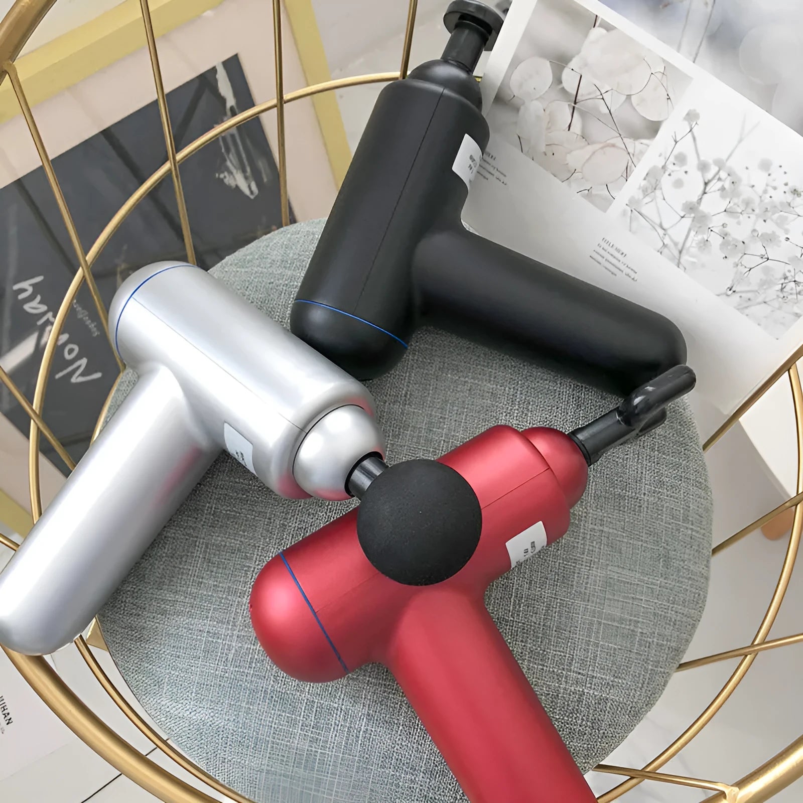 Grey fascia gun muscle massager with USB charging port for percussive therapy