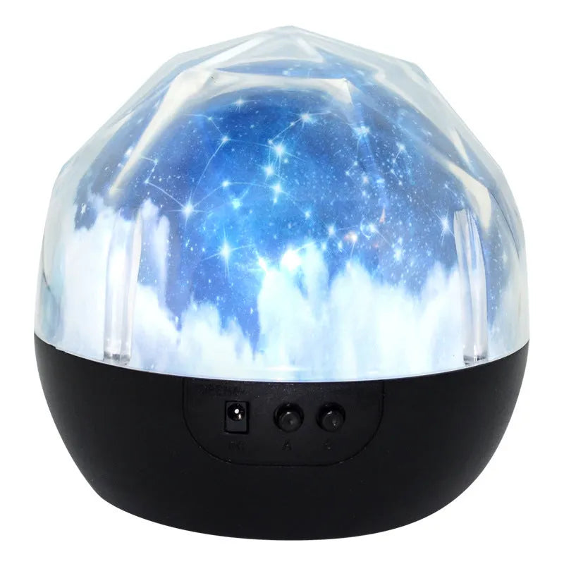Bluetooth star projector showing cosmic light projection with plastic shade and push-button controls