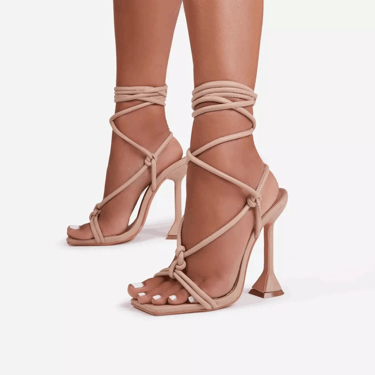 Women's high heel strappy sandals in black with square toe, stiletto heel, and cross-strap upper