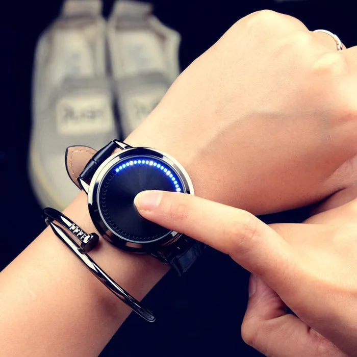 Electronic digital watch with blue light display showing numbers in black or white casing