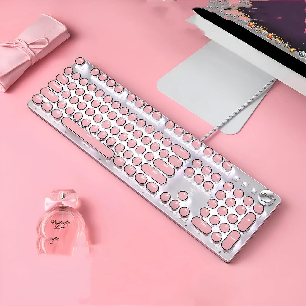 Silver and pink mechanical keyboard with round keys, green switches and white backlighting