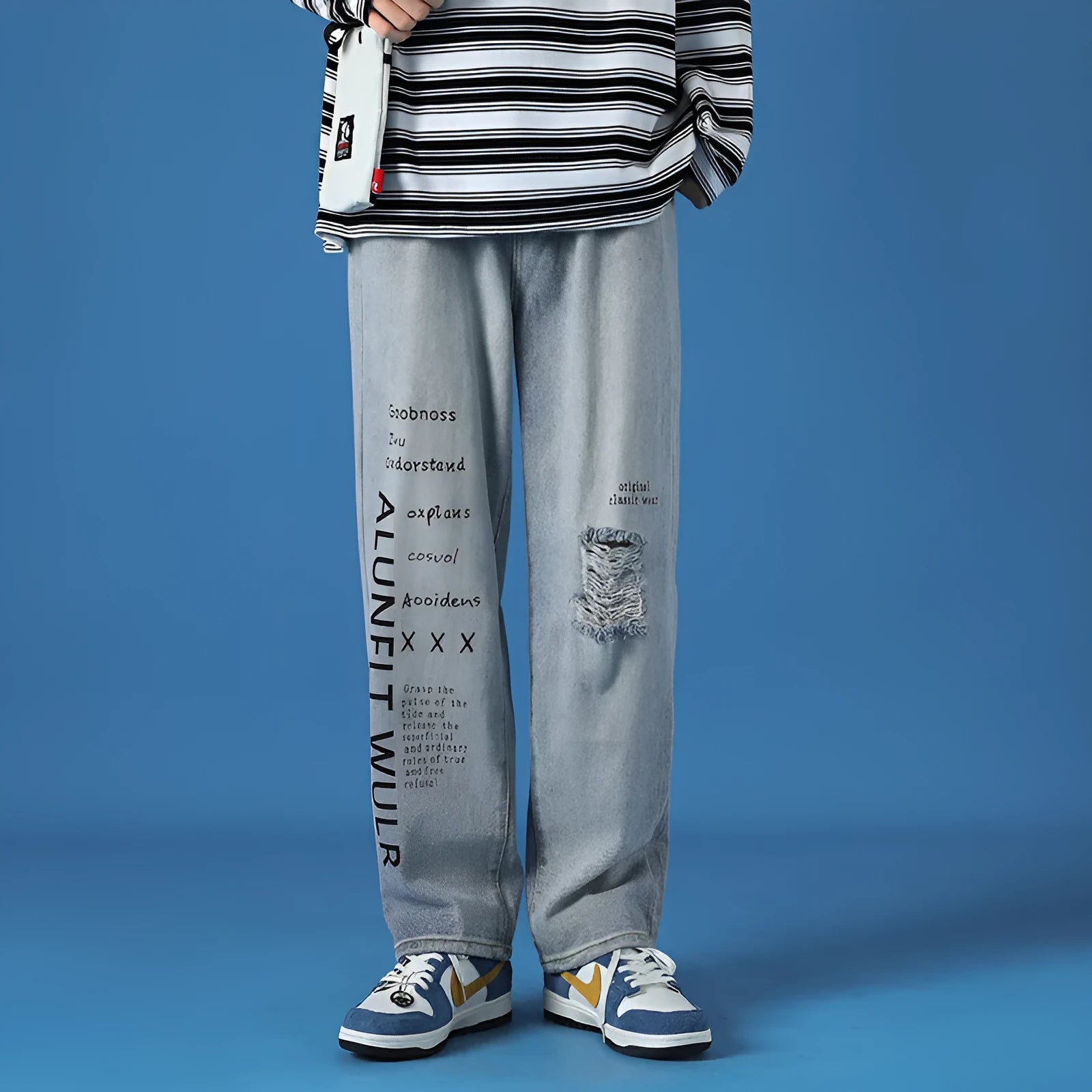 Men's loose fit washed cotton jeans in light blue with printed design and zipper fly, available in sizes M to 5XL