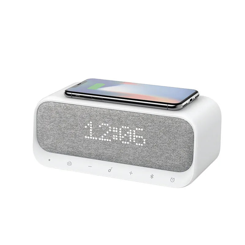Pink and white Bluetooth speaker with wireless charging pad and alarm clock display