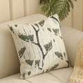 Jacquard floral pattern cushion cover in a retro colour, 45cm square, on a sofa.