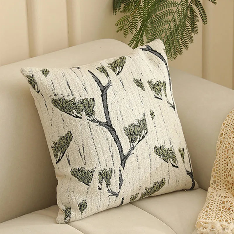 Jacquard floral pattern cushion cover in a retro colour, 45cm square, on a sofa.