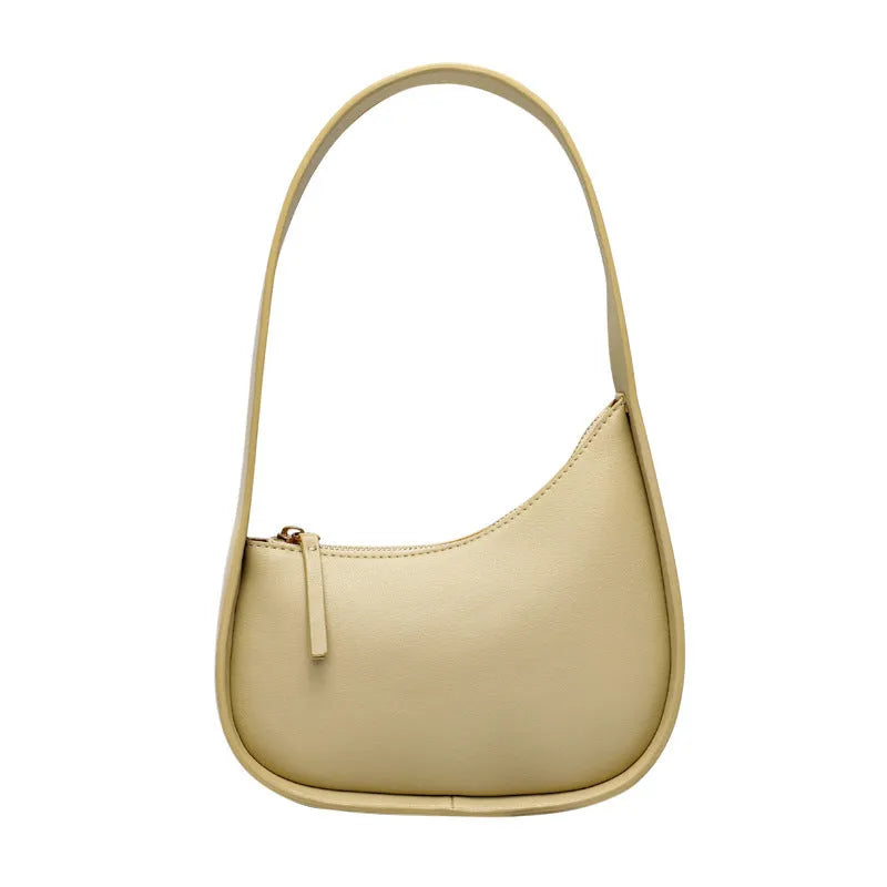 Genuine leather half moon ladies shoulder bag with wide strap and zipper closure in small size
