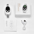 White handheld sleep aid device with remote control and wearable bracelet on charging cable