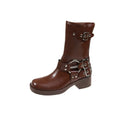 Women's black platform boots with a silver buckle detail at mid-calf height.