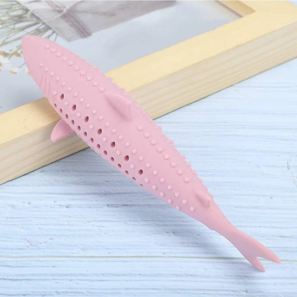 Green silicone fish shaped cat chew toy with breathable side holes on a white background