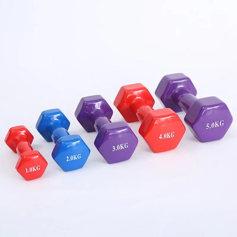 Bright coloured plastic dumbbells in 0.5kg, 1kg and 1.5kg sizes for home fitness with glossy surface