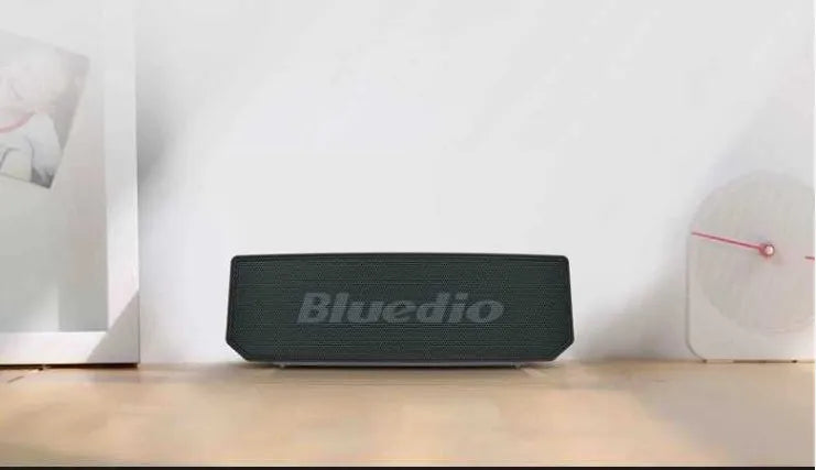 Black BS-6 cloud smart speaker showing compact rectangular design and micro-USB port.