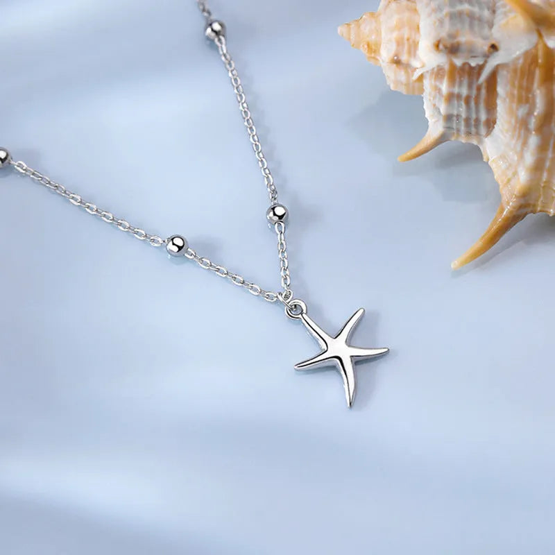 Women's S925 sterling silver anklet with a starfish charm on a round bead chain.