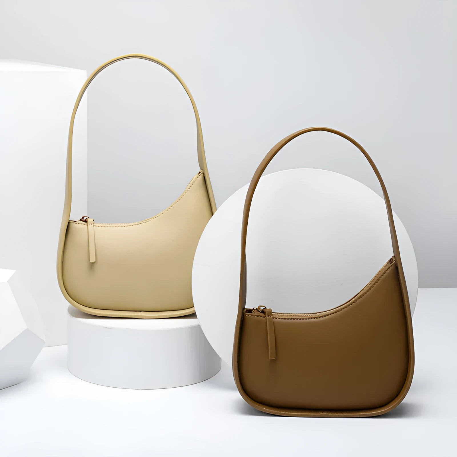 Genuine leather half moon ladies shoulder bag with wide strap and zipper closure in small size