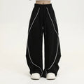 Black pleated wide-leg hip hop pants with striped pattern and mid waist, loose fit polyester streetwear trousers