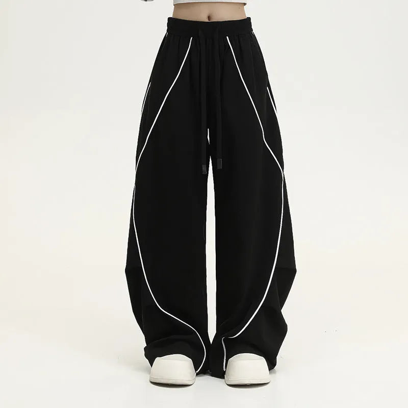 Black pleated wide-leg hip hop pants with striped pattern and mid waist, loose fit polyester streetwear trousers