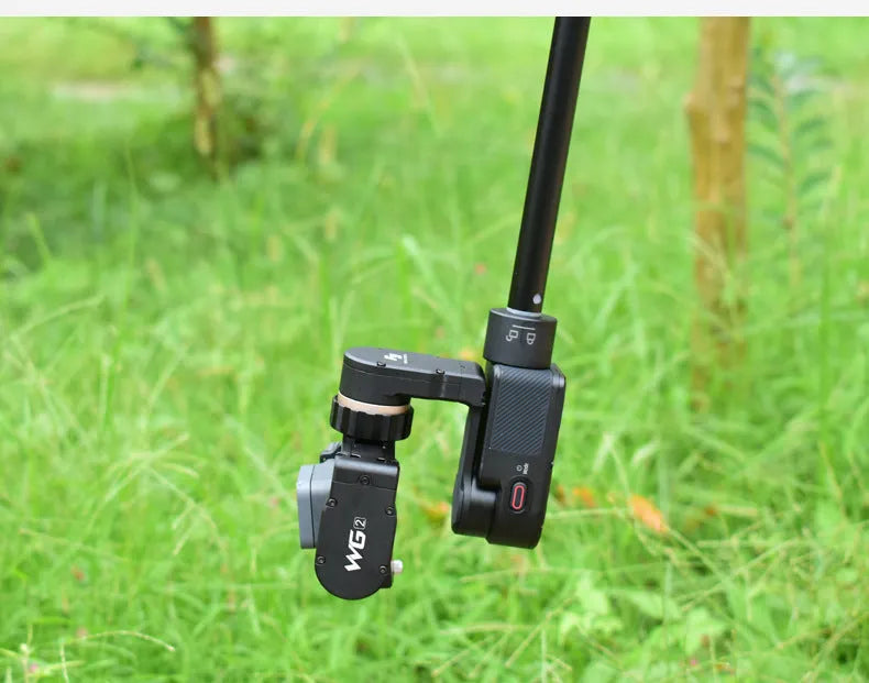 Black retractable selfie stick extended with smartphone mounted in adjustable holder