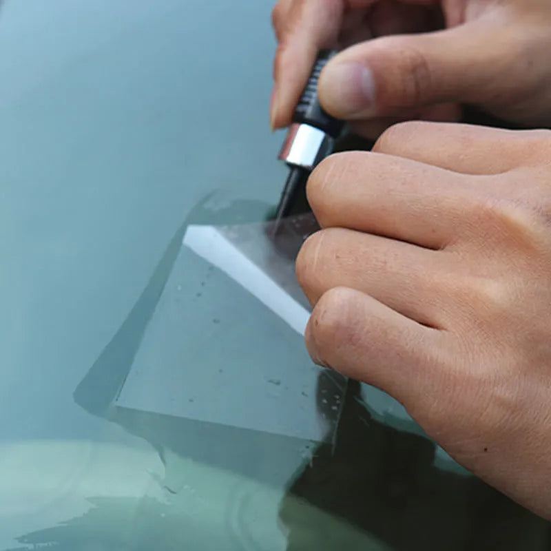 Yellow car windscreen repair kit with three pieces including UV curing resin and injection tools