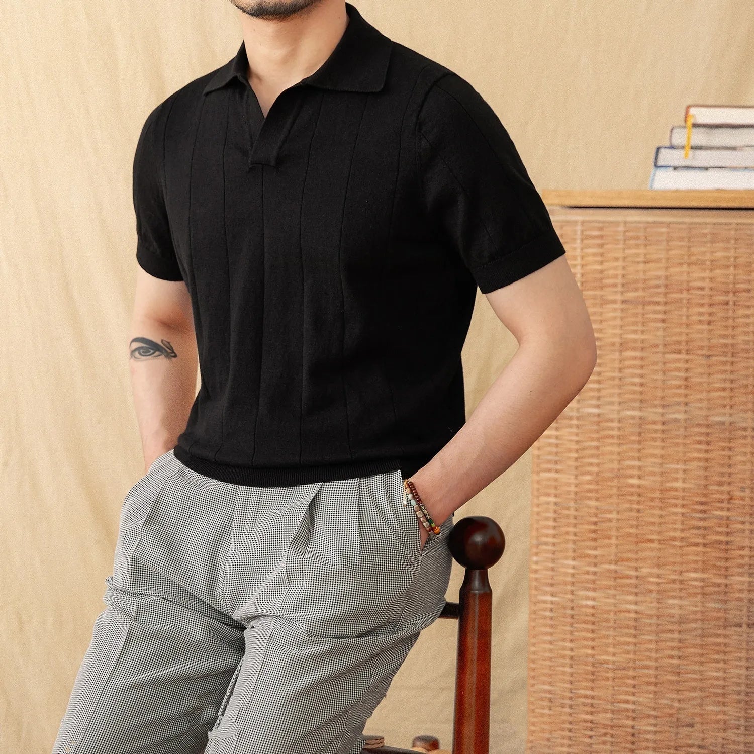 Men's purple sunken stripe knitted polo shirt with a seagull collar on a hanger.