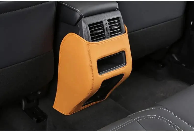Three leather anti-kick pads for 2023 Outlander interior protection in black, grey, and brown colour options