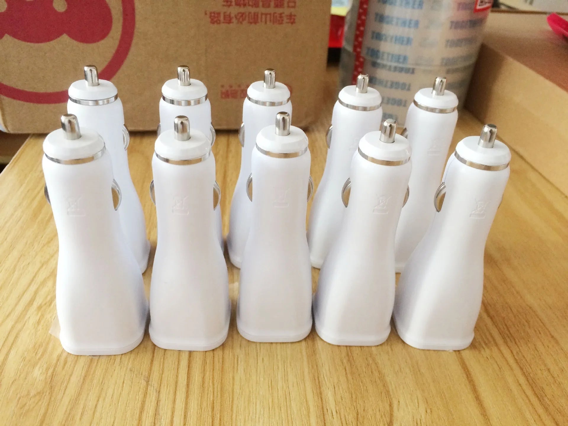White QC2.0 single port USB car charger showing compact dimensions for vehicle installation