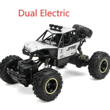 Black and silver remote control climbing cars with 2.4G wireless controller on a rough surface.