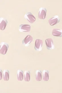 24 white plaid-pattern false nail tips laid out on a surface