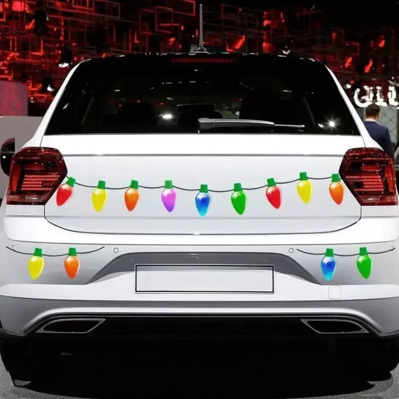 Set of magnetic reflective Christmas light bulb and wire stickers on a metal surface.