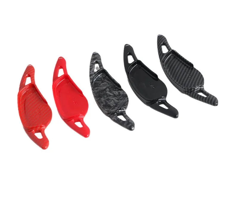 Carbon fibre steering wheel shift paddle in ABS plastic showing five colour finish options