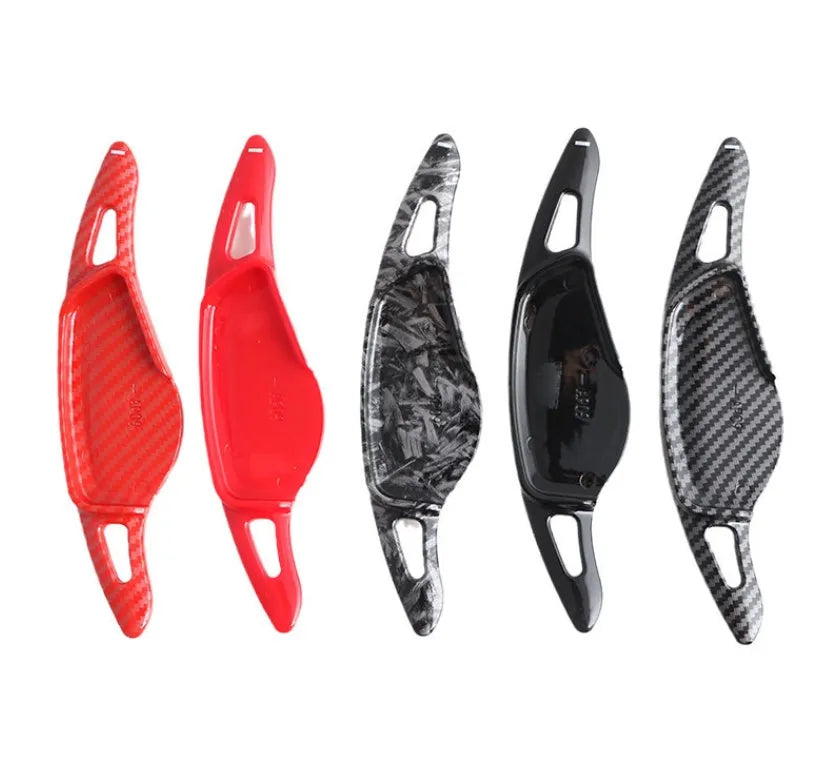 Carbon fibre steering wheel shift paddle in ABS plastic showing five colour finish options