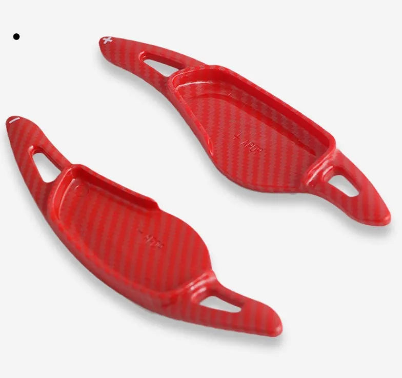 Carbon fibre steering wheel shift paddle in ABS plastic showing five colour finish options
