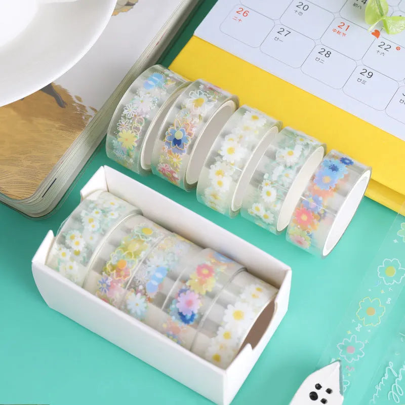 Five rolls of transparent adhesive tape with Midsummer Daisy cartoon decoration on a clear background.