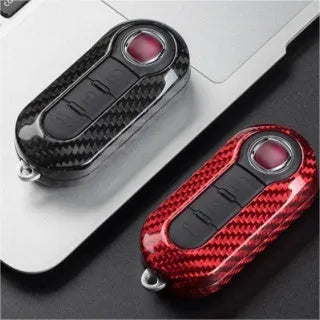 Carbon fibre and glass fibre replacement shell for a car remote key fob.