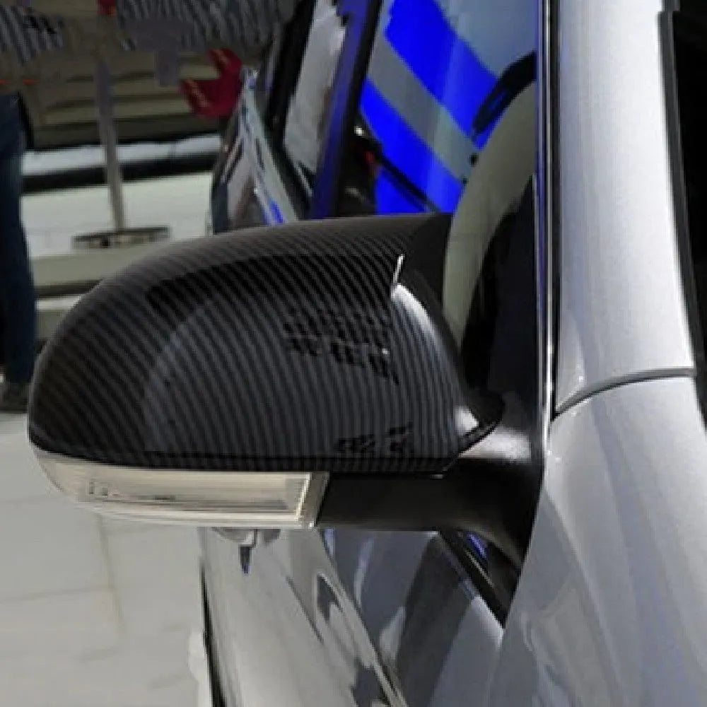 Pair of Horn Bright Black Volkswagen Sagitar exterior mirror housings for 2006-2011 models.
