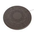 Square wireless phone charger with magic array pattern showing black colour option on desk surface
