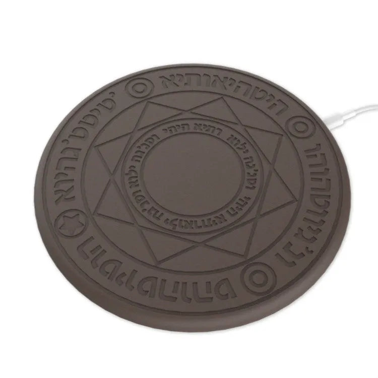Square wireless phone charger with magic array pattern showing black colour option on desk surface