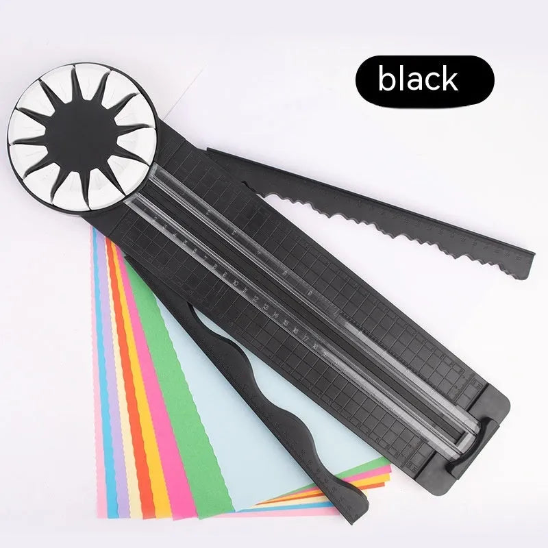 Pink and black plastic paper cutting machine with 12 patterns on desktop