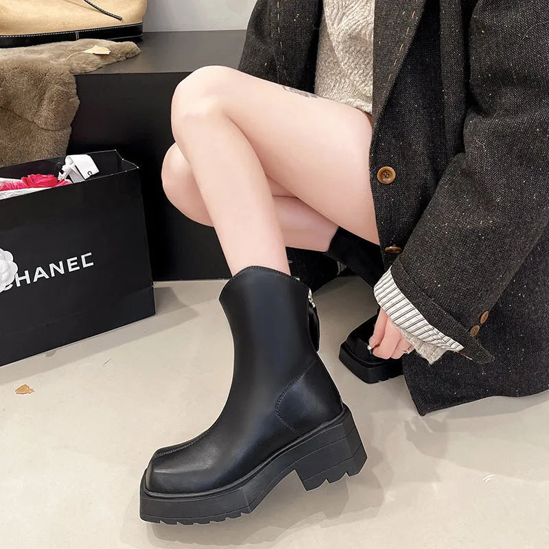 Black platform Martin boots for women with square toe, high heel, and back zipper.