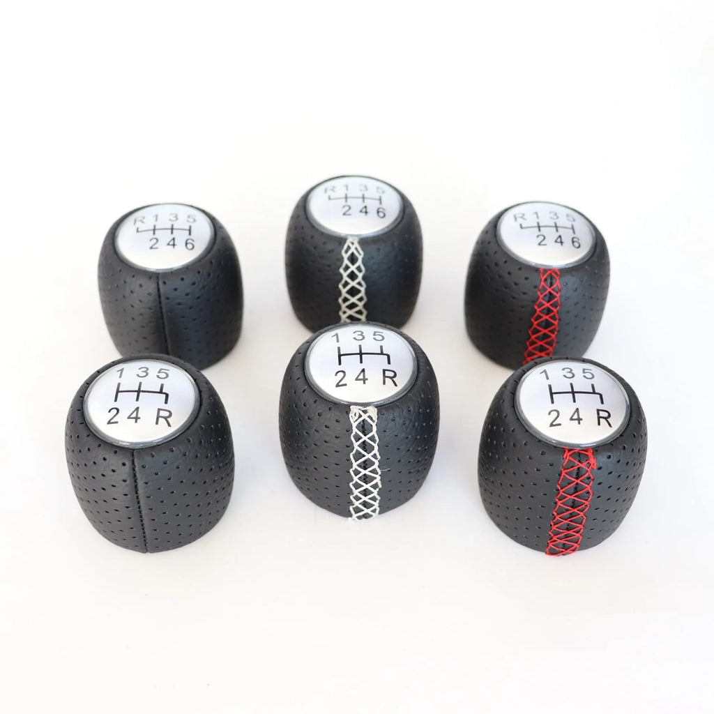 Black leather handball gear with perforations for Alpha car, shown with silver and matte cover options.